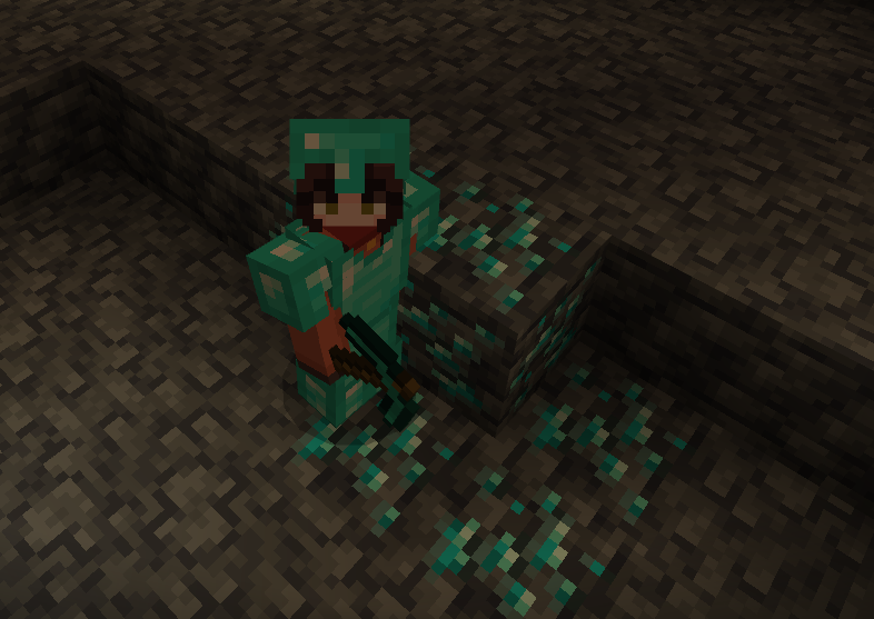 A Minecraft player mining a vein of diamond ore deep in a cave