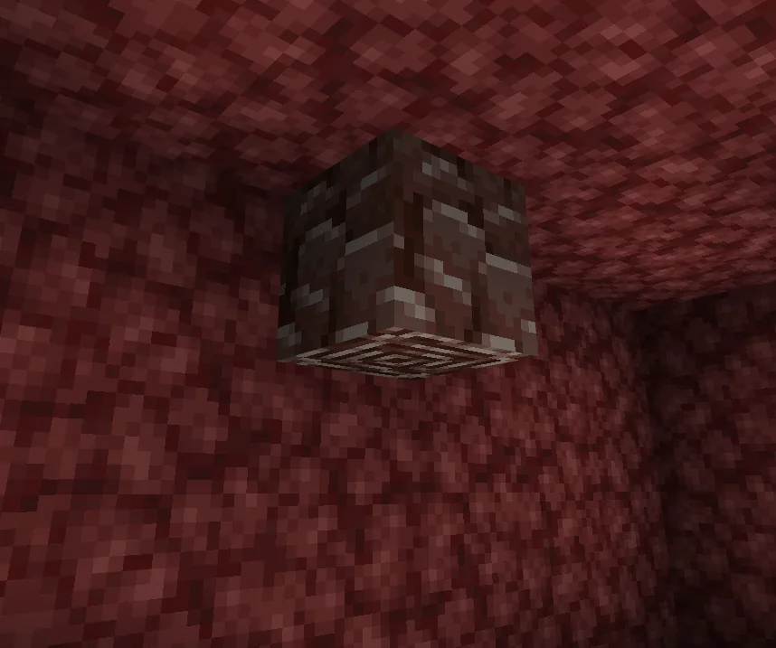 A single ancient debris block embedded in Nether netherrack — the rarest ore in Minecraft