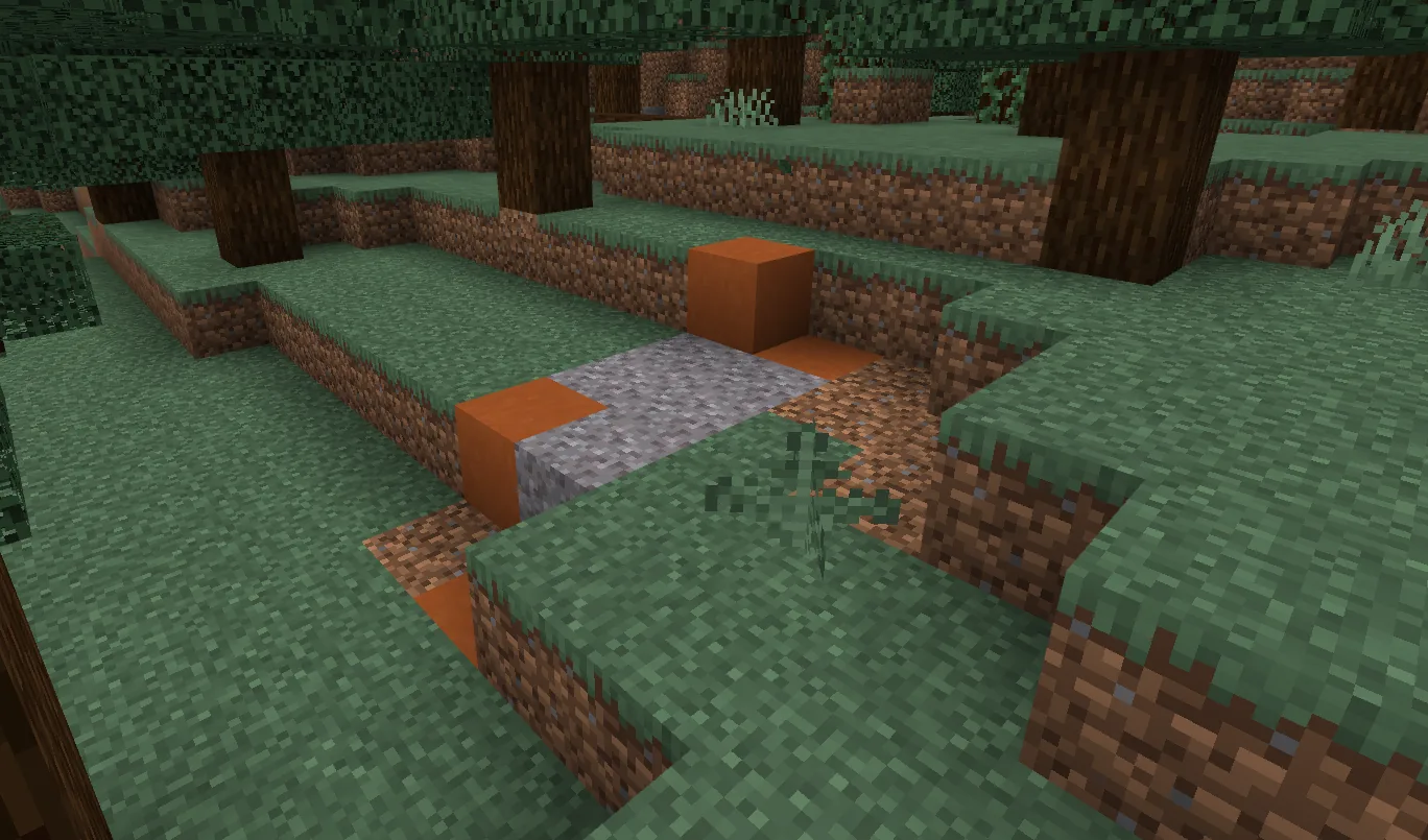 A top-down view of a Minecraft trail ruins layout — partly-buried stone bricks with suspicious gravel patches